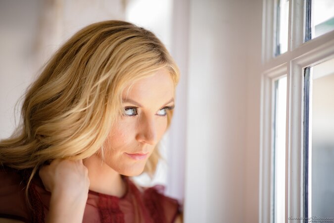 Slim blonde MILF stays naked by window and waits for girlfriend's arrival