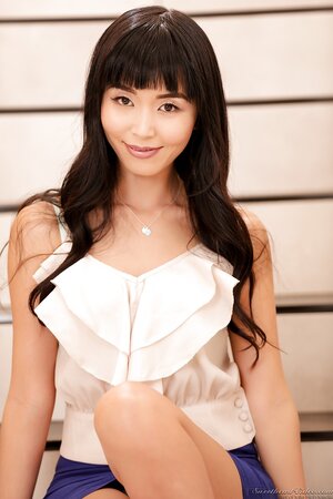 Japanese porn actress Marica Hase takes off an elegant outfit on the stairs