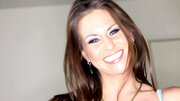 A busty woman with nipple piercings removes her sexy bikini
