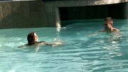 A hot brunette plays with her man in the pool and in the bedroom