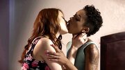 Two hot ladies are on the bed, teasing and touching each other