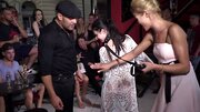 Petite brunette humiliated by two men and blonde in public