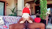 Sensational blonde Penny Pax rides on a large black pecker