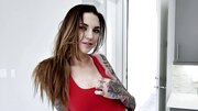 Naughty inked chick talks dirty and plays with a dildo