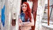 Redhead is having some sex while outside in a ruin