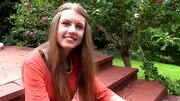 Enticing gal with cute face touches sweet pussy solo at home