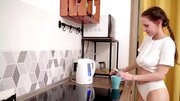 Russian cutie with natural tits masturbates in the kitchen