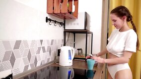 Russian cutie with natural tits masturbates in the kitchen