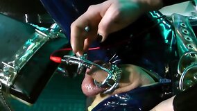 Kinky mistress dominates her slave in latex BDSM scene