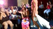 A stripper that has an athletic body gets naked for some ladies