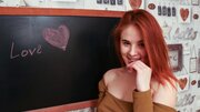 Pale redhead with an amazing figure is fingering herself