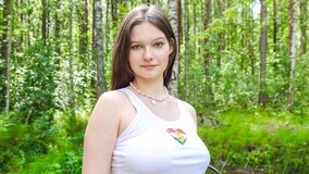 Attractive brunette goes for a solo ride in the park